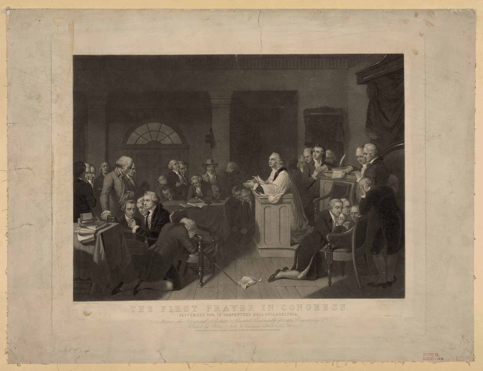 Delegates to the First Continental Congress gathered for prayer in a hall, some seated and some standing with bowed heads, as a minister reads before them.